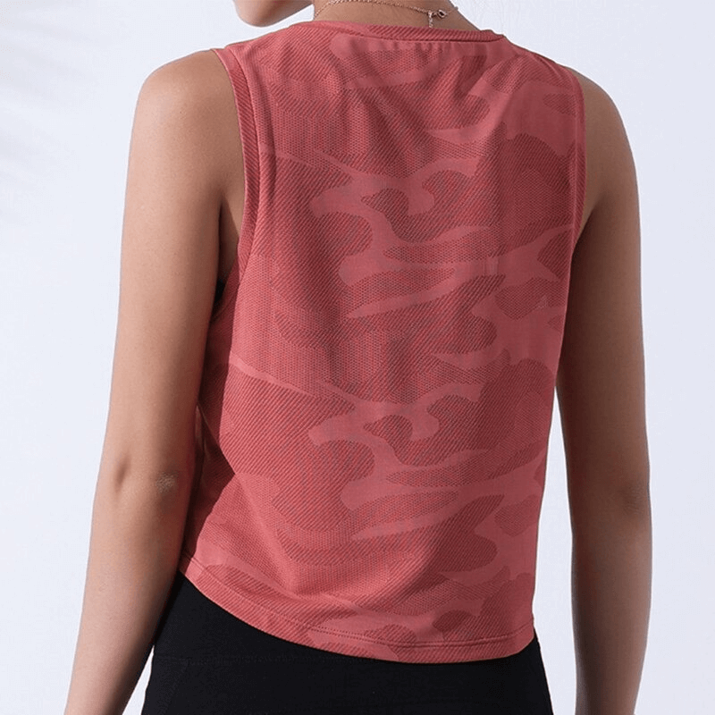 Back view of a women's camouflage running tank, breathable crop top for gym or running, in coral pink with quick-dry fabric.